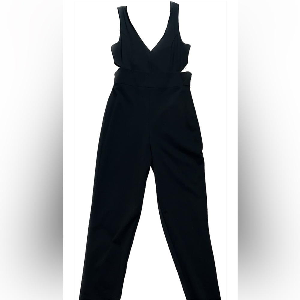 Black long pants jumper with side cut outs in a size large. Beautiful material